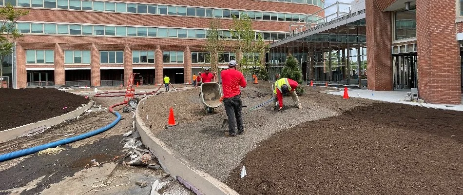 Workers installing rocks for landscape in Alpine, NJ.